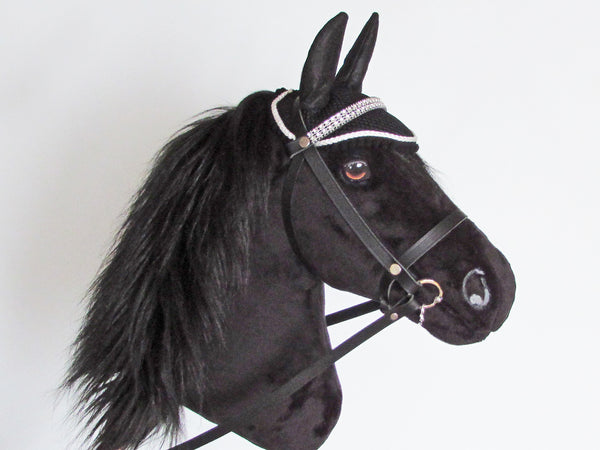 All Black Hobby Horse with leather bridle and ear bonnet