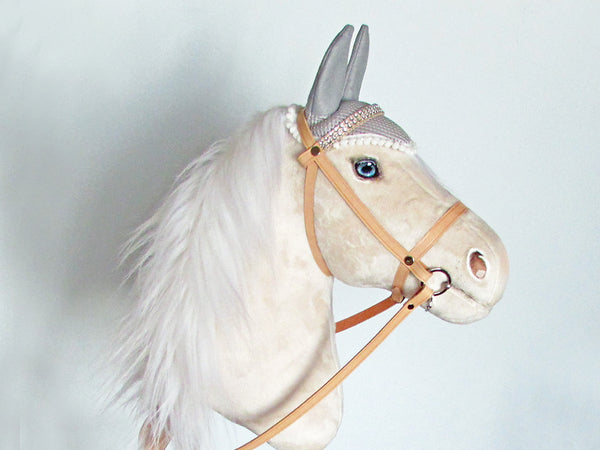 Snow Cream hobby horse with leather bridle and ear bonnet