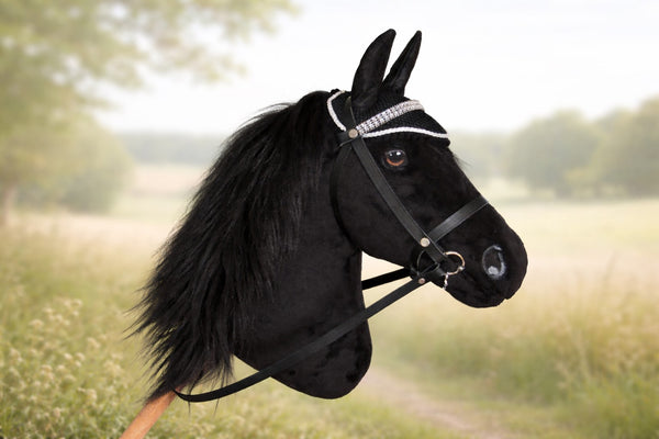 All Black Hobby Horse with leather bridle and ear bonnet